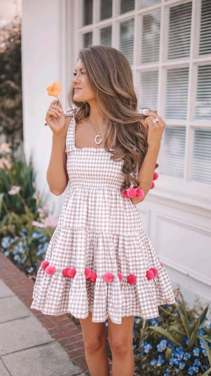 gingham mini dress with pink pom-pom trim